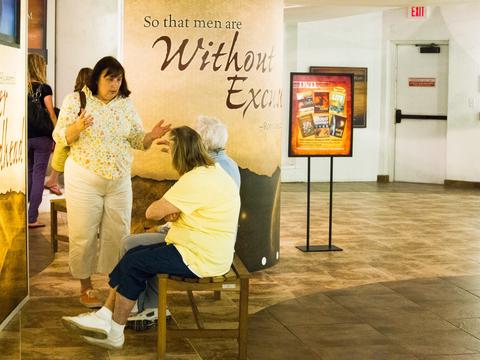 People discussing the exhibits