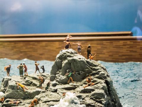 Model of people watching the Ark leave without them