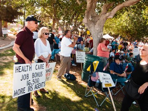 The sign says: 16,500 more IRS agents