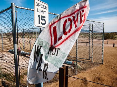 The sign says: Love, not war