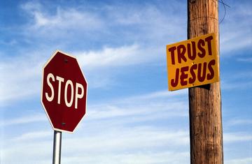 Sign reading Stop: Trust Jesus